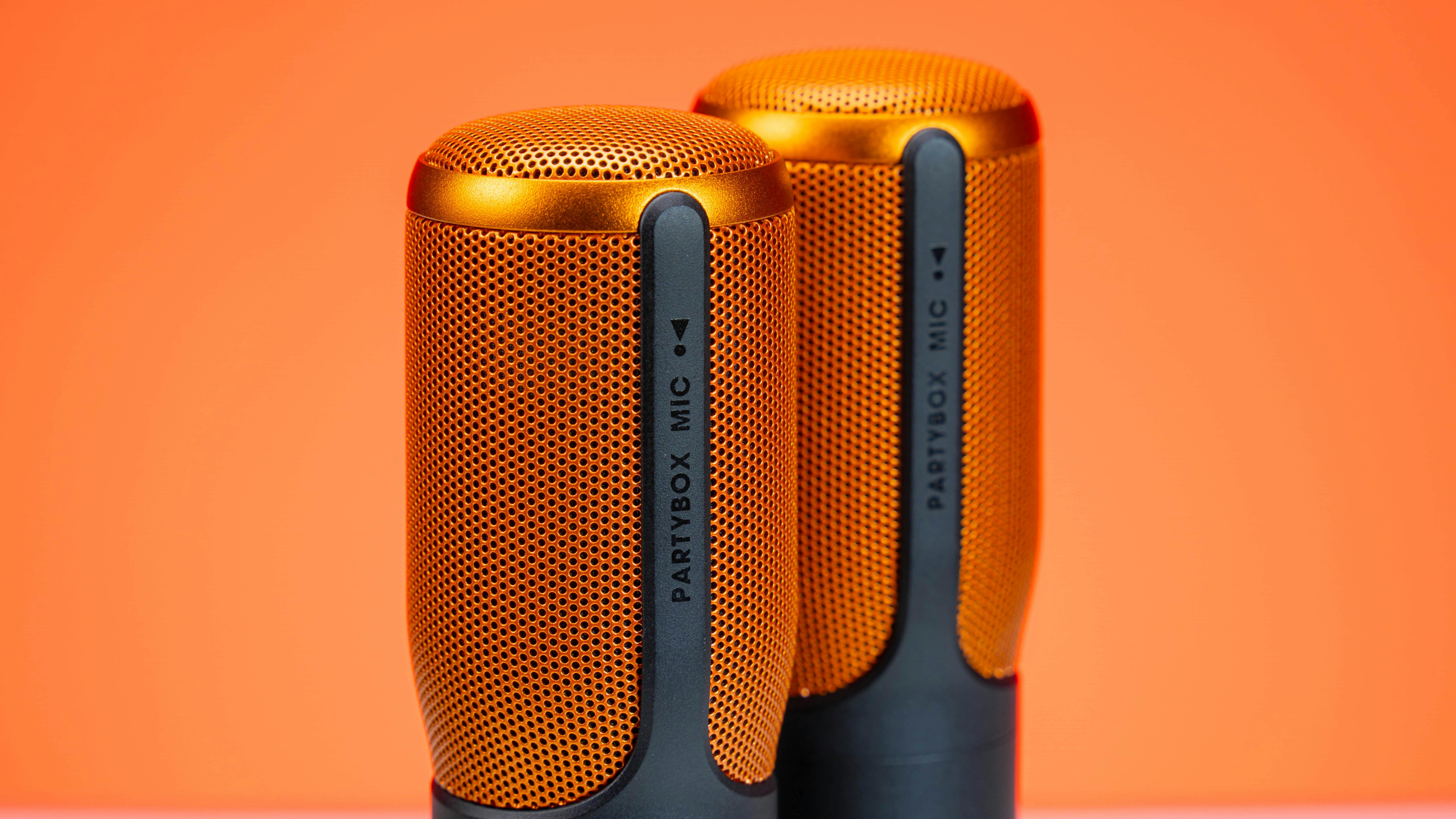 A person writing lyrics in a notebook with a pen.